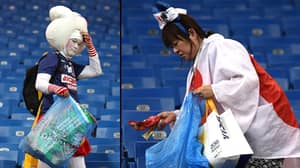 日本球迷在世界杯被淘汰后留下来打扫体育场