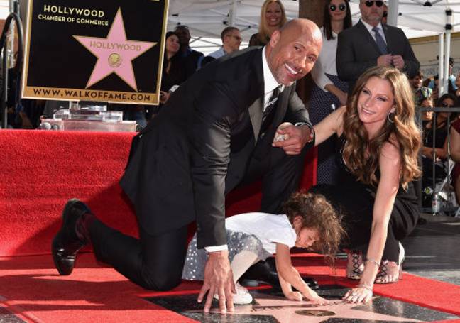 Dwayne'The Rock'Jownson与他的合作伙伴Lauren Hashian和女儿Jasmine Johnson。