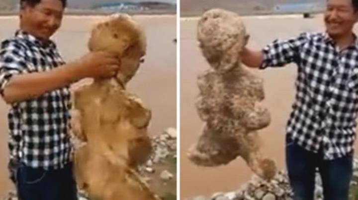 人形海洋生物活着，在中国海滩上踢