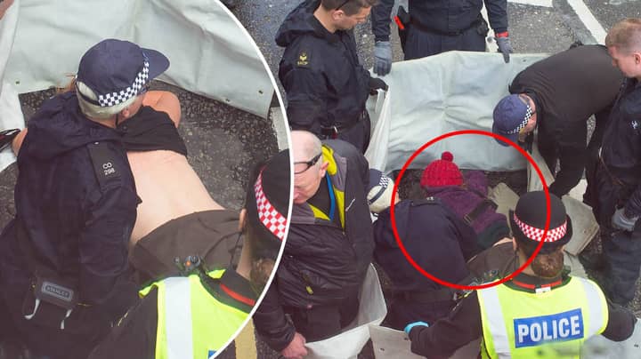 激进主义者将她的乳房粘在伦敦抗议的道路上